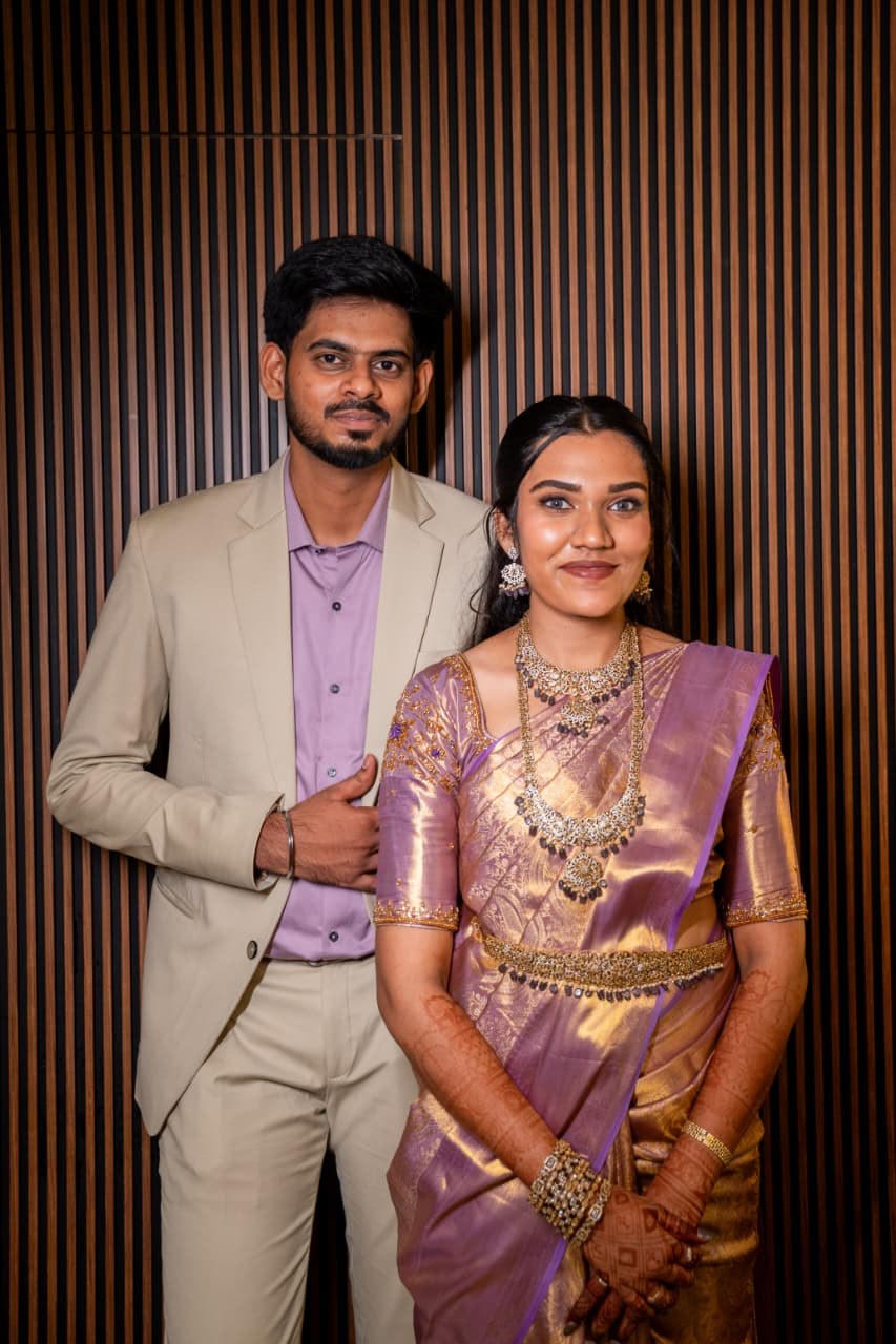 Arun and Benita posing together in elegant engagement attire